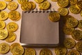 Blank notebook or calendar with golden coins Royalty Free Stock Photo
