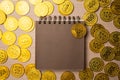 Blank notebook or calendar with golden coins Royalty Free Stock Photo