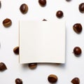 Blank notebook on chestnuts pattern background. Autumn and winter snacks Royalty Free Stock Photo