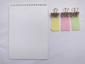 Blank Notebook with Colored Sticky Notes and Clips Royalty Free Stock Photo