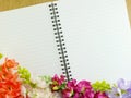 Blank notebook diary background with artificial flower background Royalty Free Stock Photo