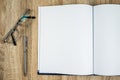 Blank notebook diary with silver pen and glasses Royalty Free Stock Photo