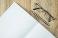 Blank notebook diary with silver pen and glasses Royalty Free Stock Photo