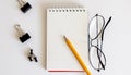 Blank notebook with glasses and pencil on the wooden table, business concept Royalty Free Stock Photo