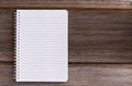 Blank notebook isolated on wood table background  with copy space for your text or image Royalty Free Stock Photo