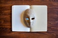 Blank notebook with papier-mÃÂ¢chÃÂ© mask