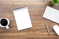 Blank notebook with pen and computer gadgets are on top of wood office desk table. Top view, flat lay Royalty Free Stock Photo