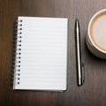 Blank notebook, pen and cup of coffee on wooden brown background, Royalty Free Stock Photo