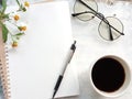 Blank notebook with pen and glasses next to a cup of coffee. Royalty Free Stock Photo