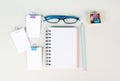 Blank notebook with a pen, paper and eyeglasses on a gray background, brainstorming for ideas, writing a message, workplace desk Royalty Free Stock Photo