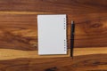 blank notebook and pen on wooden table Royalty Free Stock Photo