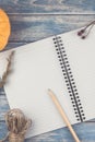 Blank notebook with pencil and autumn pumpkins Royalty Free Stock Photo