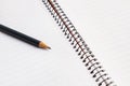 A blank notebook and a pencil in a close up view Royalty Free Stock Photo
