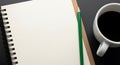 A blank notebook and pencil next to a cup of coffee on a dark surface Royalty Free Stock Photo