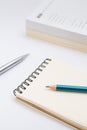 Blank notebook with pencil on white background Royalty Free Stock Photo