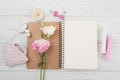 Blank notebook, pink crochet holdel, earphones