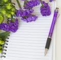Blank notebook with statice flower