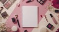 Flat lay beauty products, makeup brushes, lipstick, eyeshadow palette, flowers and notebook Royalty Free Stock Photo