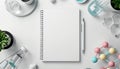 Overhead view of a blank notebook with pen and science themed objects on a white surface flat lay Royalty Free Stock Photo