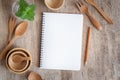 Blank notebook for text note on wooden table background. On wooden have spoon fork and pencil Royalty Free Stock Photo