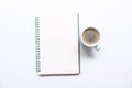 Blank notebook for text on white office desk table with cup of black coffee. Blank notebook page for input the text in the middle Royalty Free Stock Photo