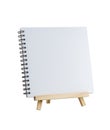 Blank notebook on wooden tripod standing isolated on white background Royalty Free Stock Photo