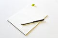 Blank notebook with yellow clipboard and pencil