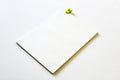 Blank notebook with yellow clipboard