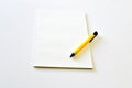 Blank notebook with yellow pen