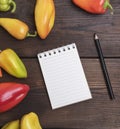 Blank notepad with a black wooden pencil on a brown table Royalty Free Stock Photo