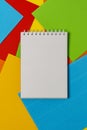 Blank notepad on the colored embossed paper sheets Royalty Free Stock Photo