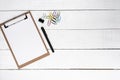 Blank notepad with fountain pen and various clips over white woo Royalty Free Stock Photo