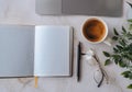 Blank notepad with laptop and coffee cup on desk, workspace template Royalty Free Stock Photo