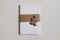 Blank notepad mockup. Cotton paper diary with rough edges, craft belly band, tape isolated on beige table background