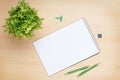 Blank notepad, pen and flower on wooden table Royalty Free Stock Photo