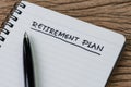 Blank notepad with pen and handwriting important headline as Retirement Plan on wood table, planning for saving and investment