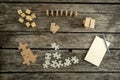 Blank notepad, pencil and piles of puzzle pieces, wooden blocks Royalty Free Stock Photo