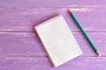 Blank notepad and pencil on wooden board Royalty Free Stock Photo