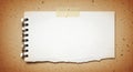 Blank notepad sheet taped on rustic craft paper texture Royalty Free Stock Photo