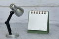 Blank notepad and table lamp with customizable space for text or ideas. Copy space Royalty Free Stock Photo