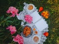 Blank notepad to write, Picnic in vintage style with pink peonies, Fruits and bread, Bright sunny day, Top view, Selective focus