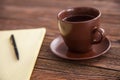 Blank notepad on a wooden table