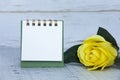 Blank notepad and yellow roses with customizable space for text or ideas. Copy space Royalty Free Stock Photo