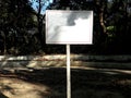 Blank notice board in the forest.White blank sign board in the green park Royalty Free Stock Photo