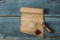 scrolls of old paper on a wooden table. Antique background Royalty Free Stock Photo