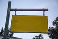 Blank Old Weathered Road Name Signage Hanging from Rusty Chain and Metal Rod Horizontally. Closeup Angle Shot of