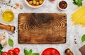 Blank old wooden board with ingredients for cooking Italian past Royalty Free Stock Photo