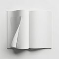 Blank open book with a turning page displaying empty white space for text and design mockups Royalty Free Stock Photo