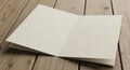 Blank open card on wooden table surface for custom design and creative projects Royalty Free Stock Photo