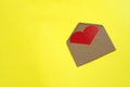 Blank open envelope with heart on yellow background Royalty Free Stock Photo